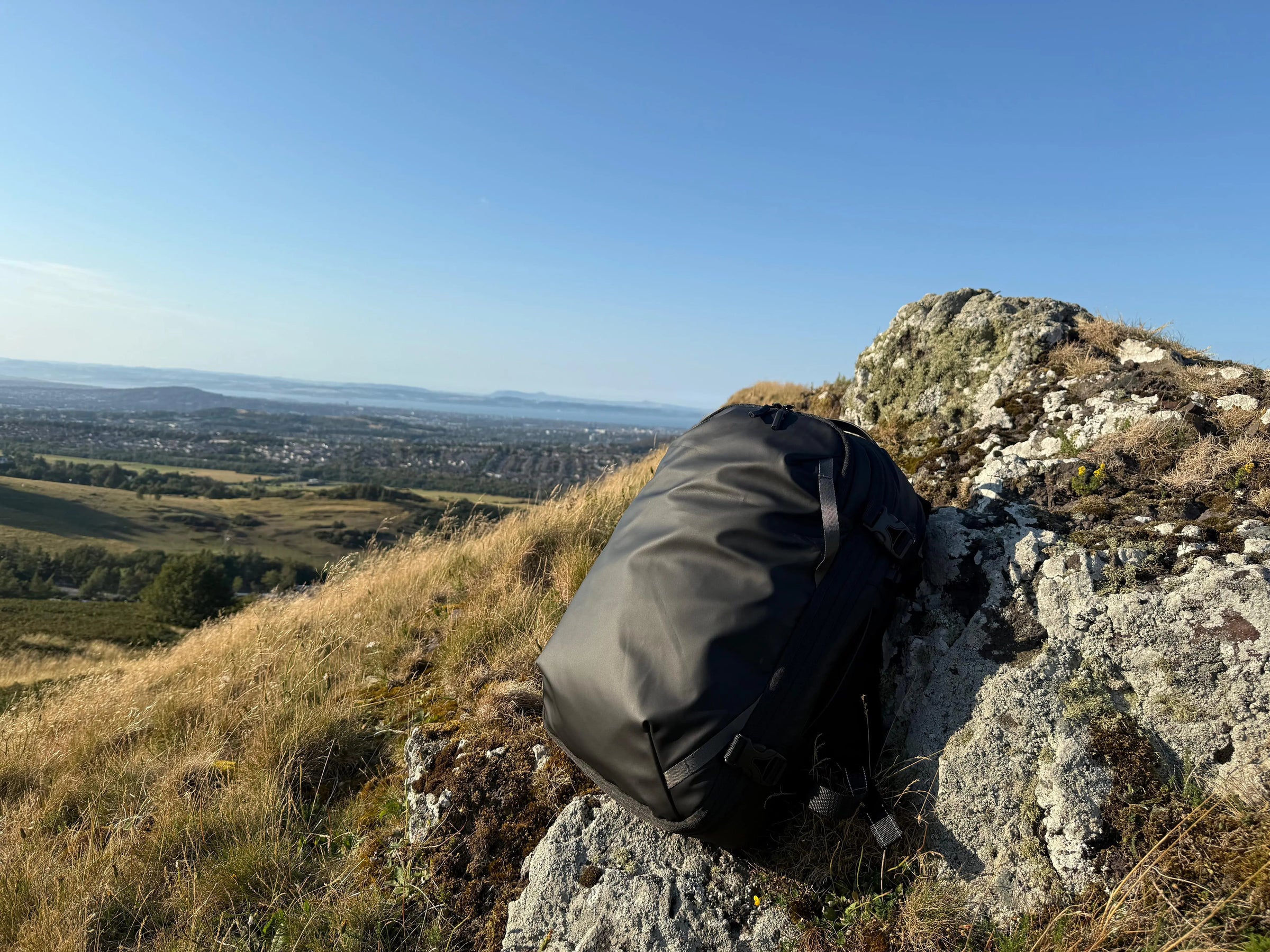 black bagpack on the mountains